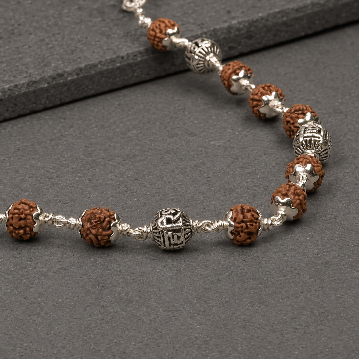 24 inch Rudraksha Mala with devotional silver detailing
