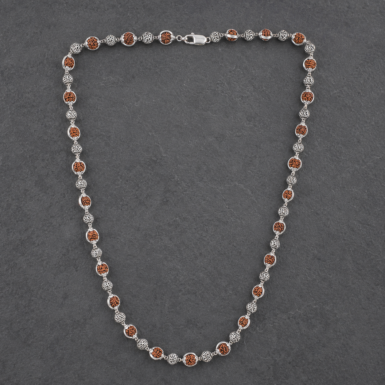 5 Mukhi Rudraksha and 925 silver capping close-up