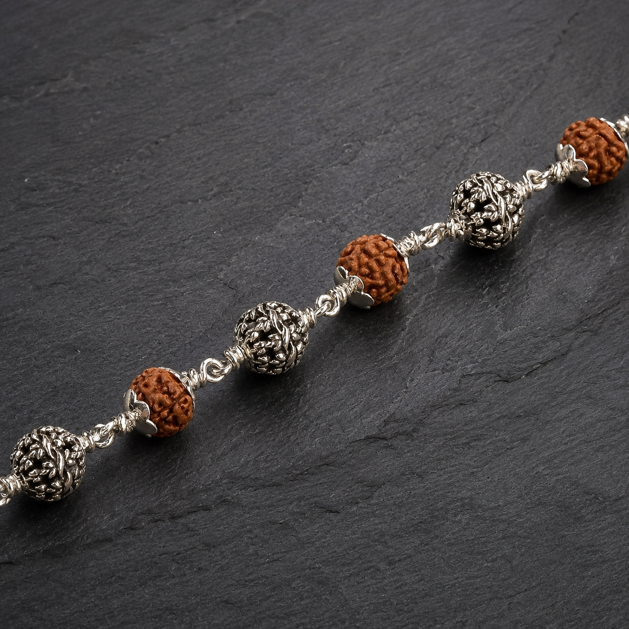 5 Mukhi Rudraksha Bracelet with Silver Flower Beads