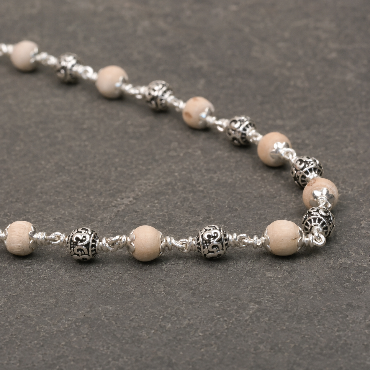 7–8 mm Tulsi Mala with 925 Silver Om Beads