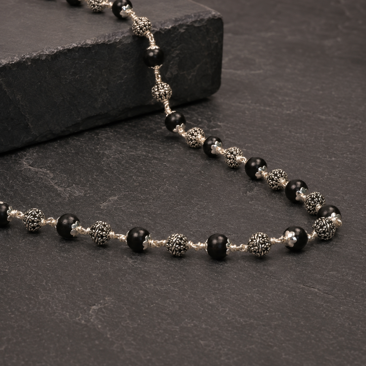 925 silver Karungali mala floral bead craftsmanship close-up
