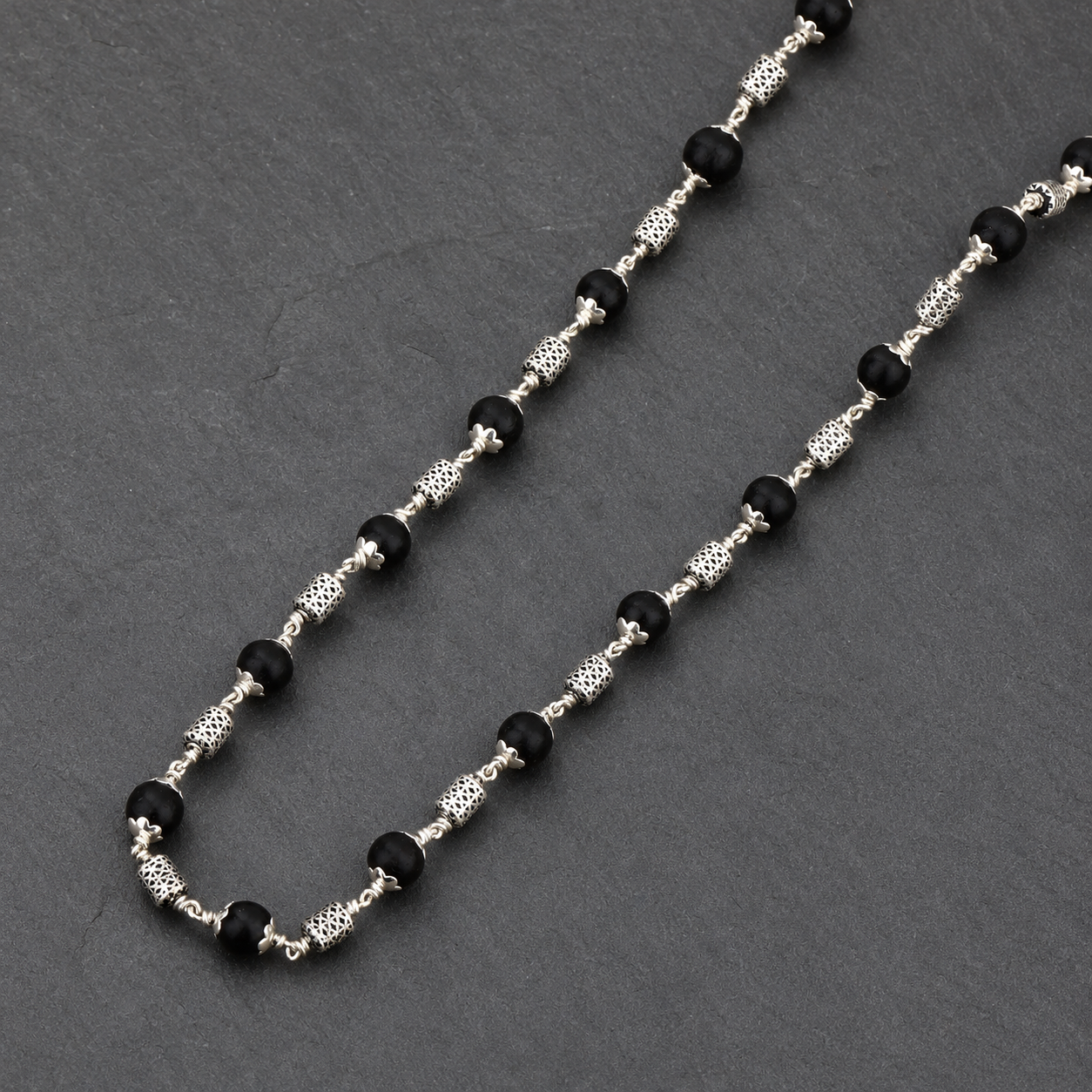 925 silver Karungali mala intricate oval bead close-up