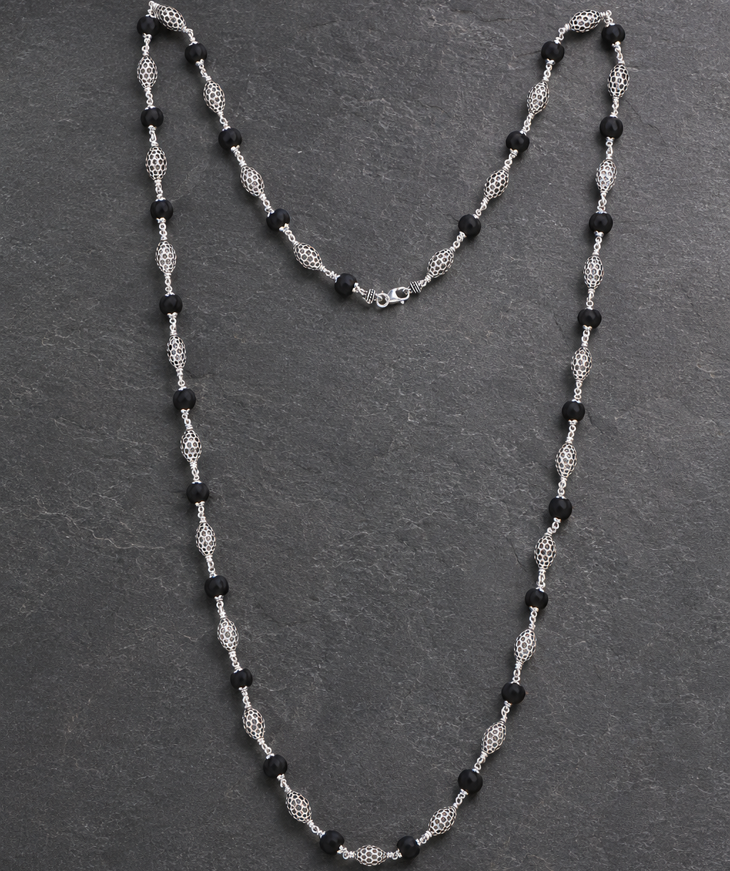 925 silver Karungali mala openwork oval bead close-up