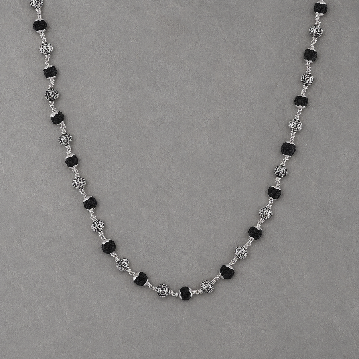 Alternating 925 silver Om beads and black Rudraksha detail