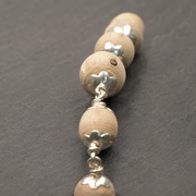 Angled view of 925 silver Tulsi Mala arrangement