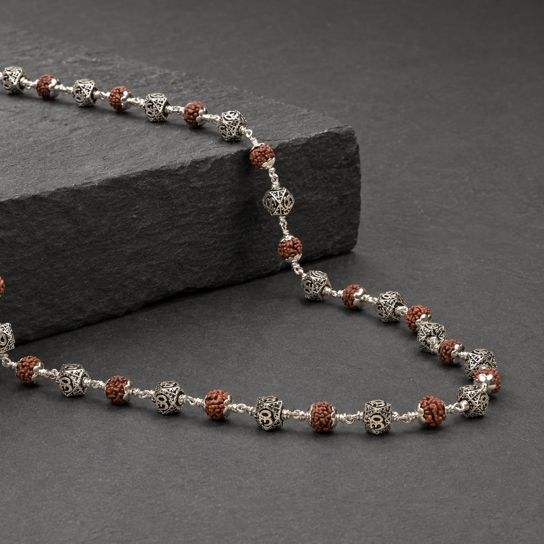 Antique 925 silver Hexagon Om beads and Rudraksha close-up