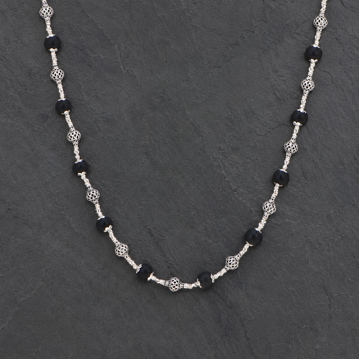 Classic round bead Karungali Mala styled for meditation