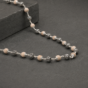 Close-up of Jay Shree Ram engraving on silver beads