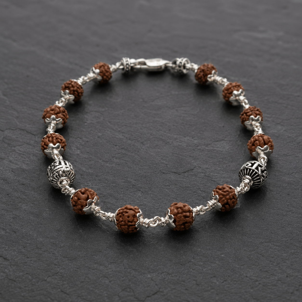 Close-up of Shree Hari devotional sterling silver beads