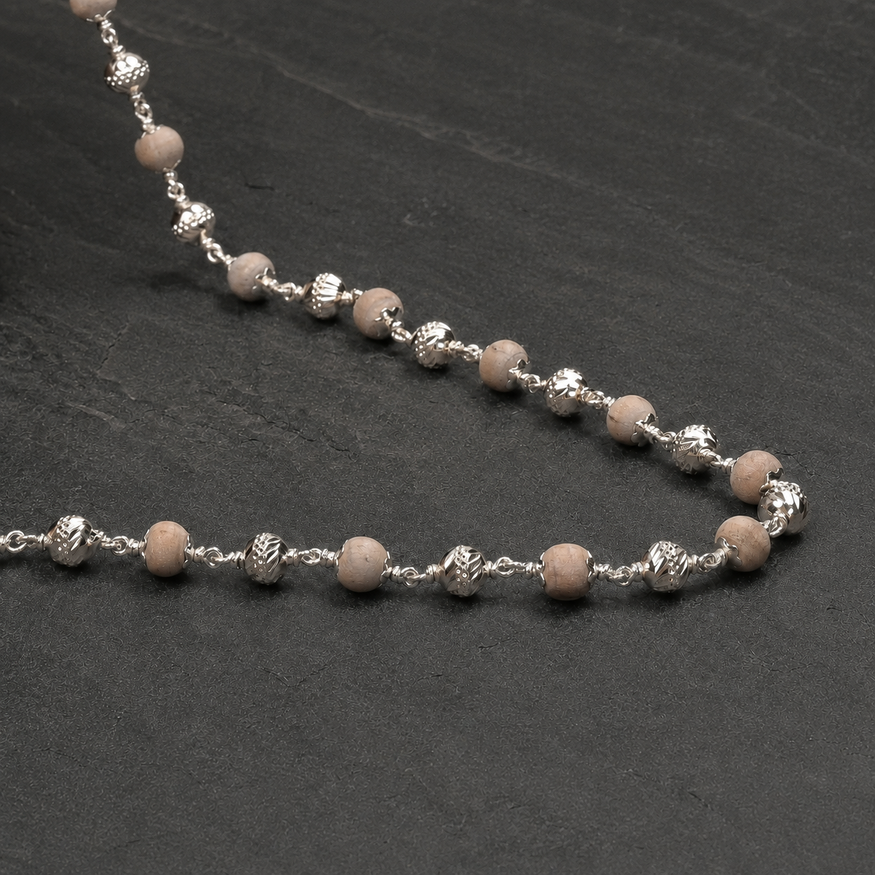 Close-up of Tulsi Mala and 925 silver CNC detailing