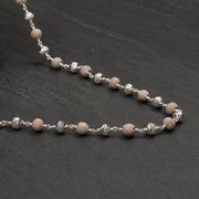Close-up of Tulsi Mala and 925 silver CNC detailing