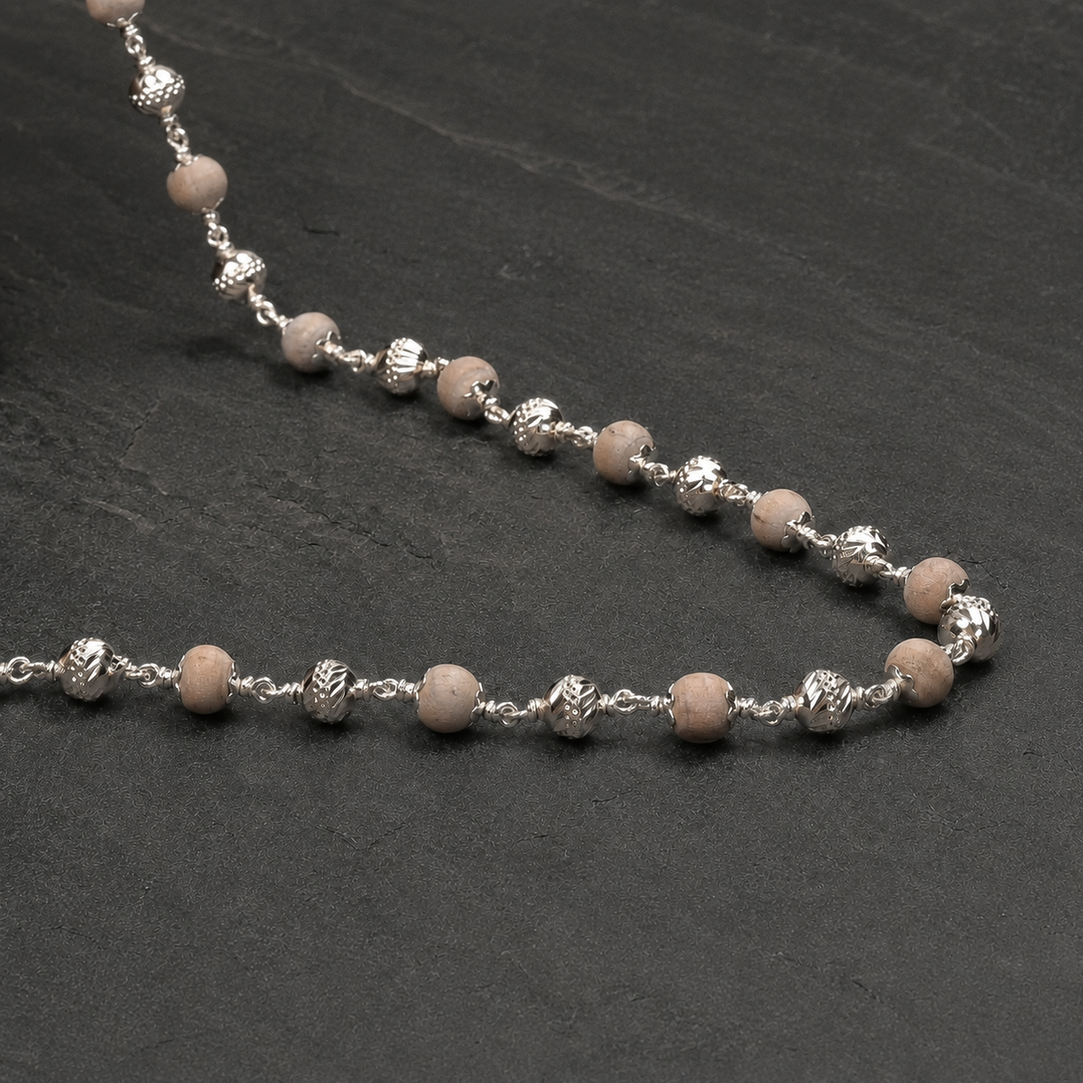 Close-up of Tulsi Mala and 925 silver CNC detailing
