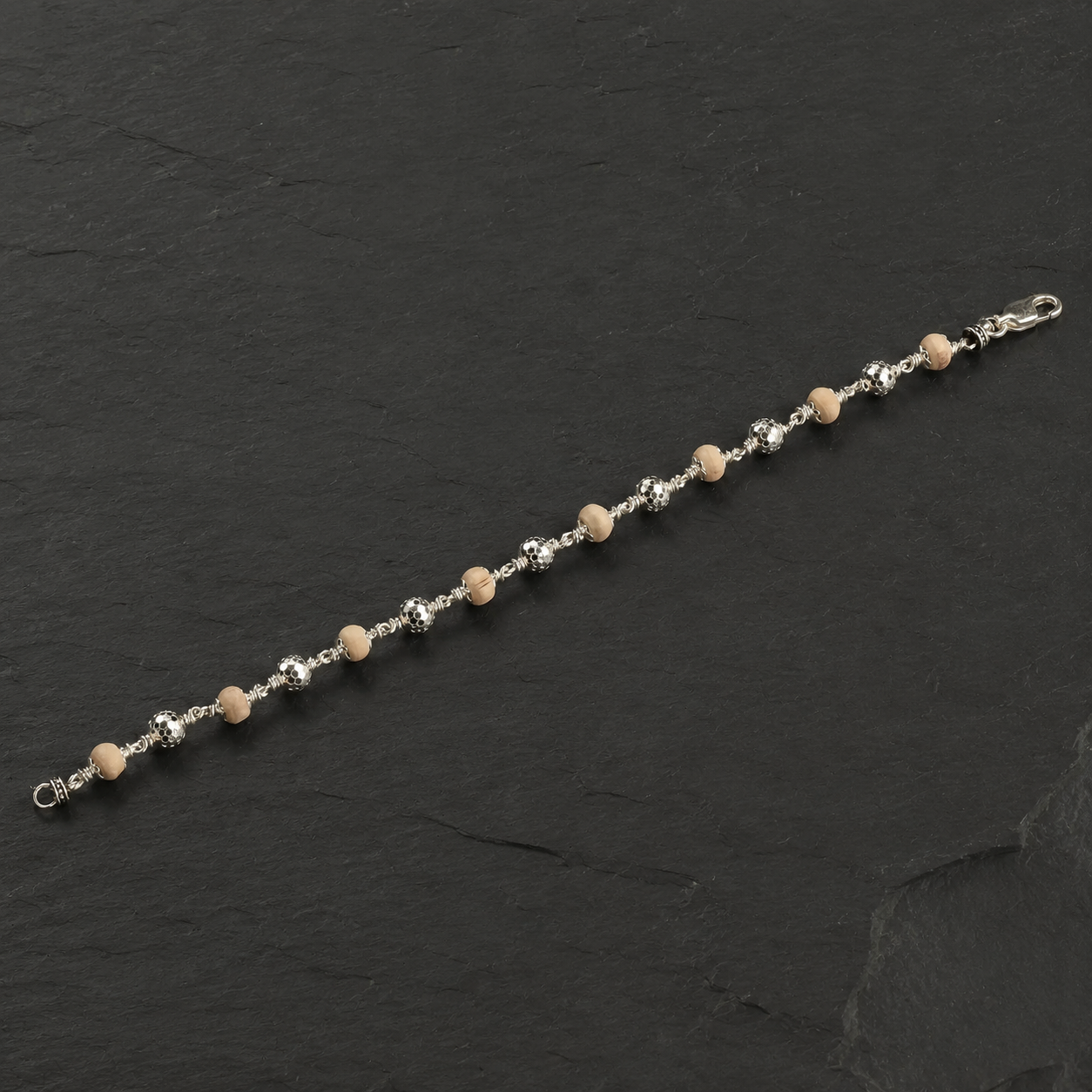 Close-up of Tulsi beads and 925 silver CNC detailing