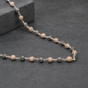 Close-up of engraved Om details on 925 silver beads