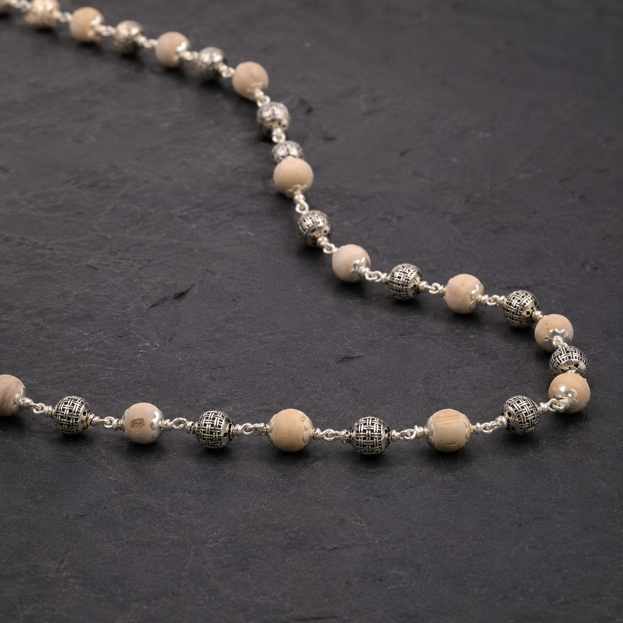 Close-up of heavy 925 silver beads on Tulsi mala