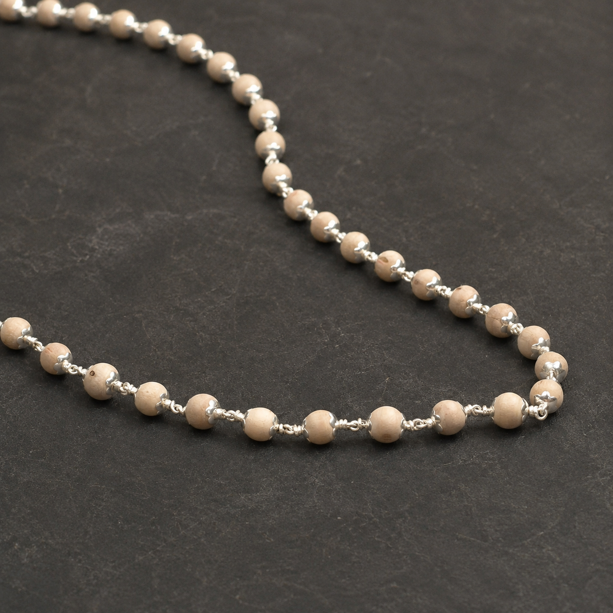 Close-up of natural Tulsi beads and 925 silver details