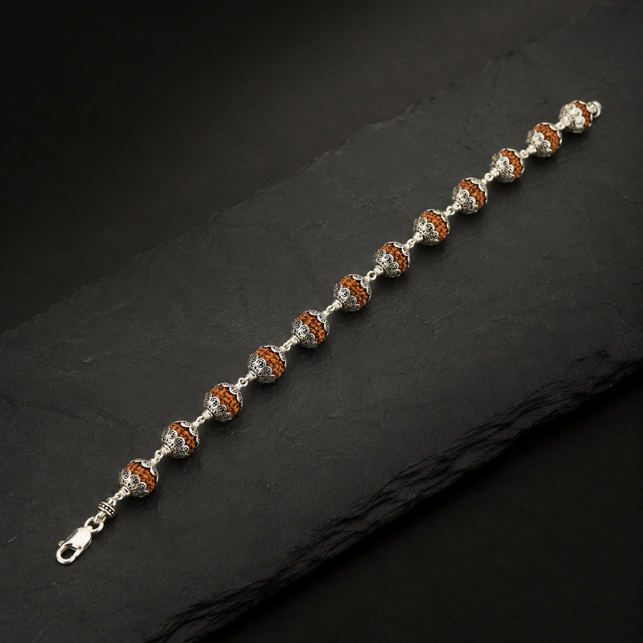 Full view of 12 bead Rudraksha Om silver bracelet