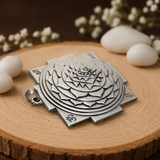 Handcrafted 925 silver Shri Yantra pendant shown in hand