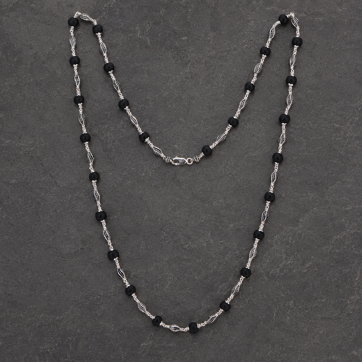 Karungali mala with 925 silver marquise beads angled view