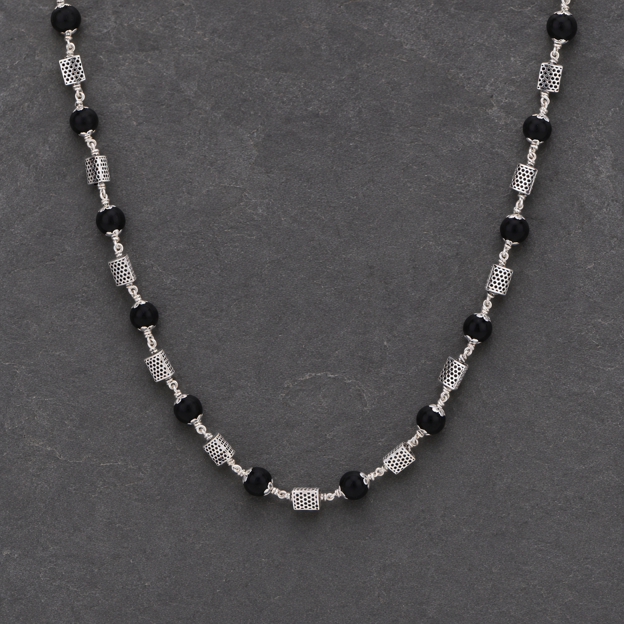 Karungali mala with 925 silver triangle beads angled view