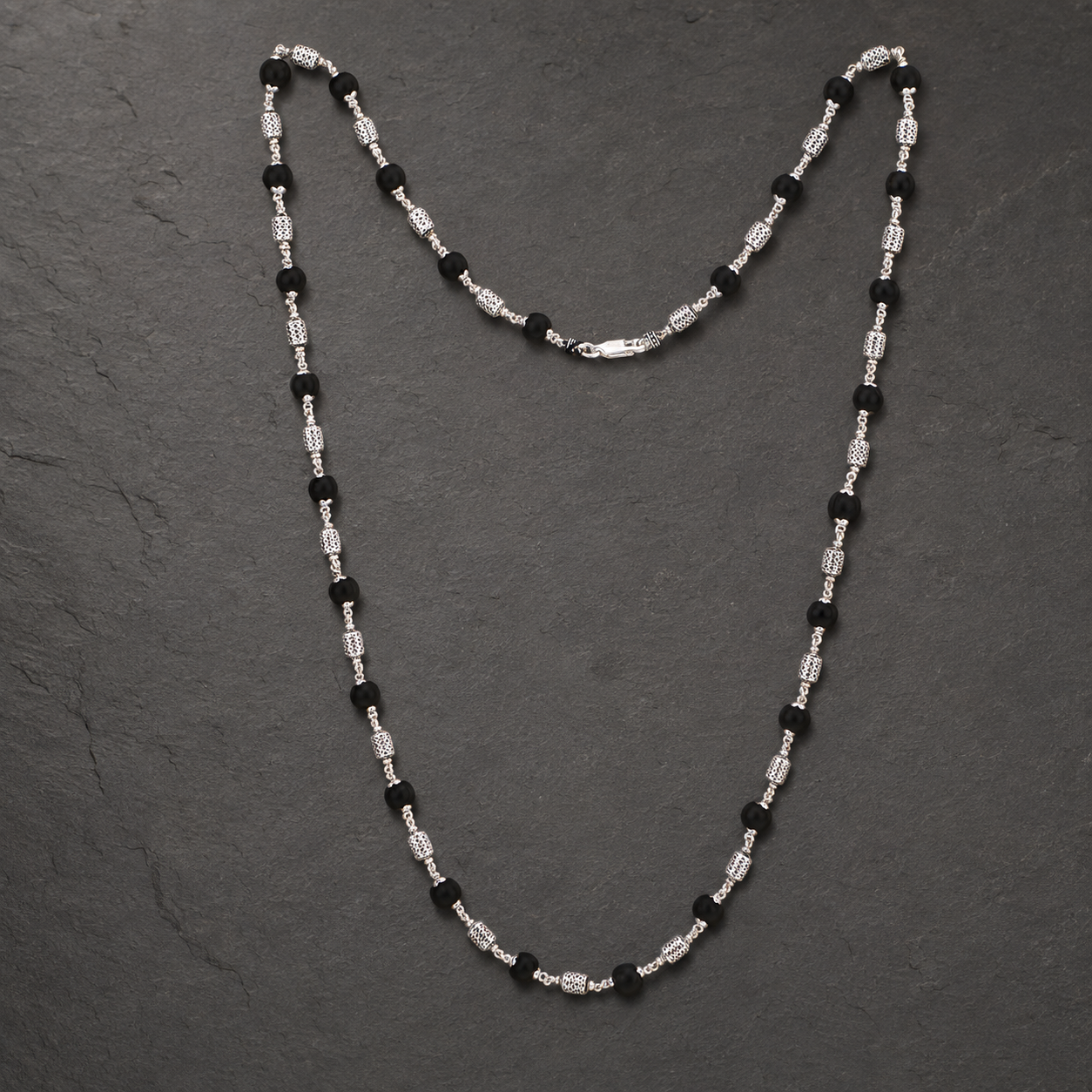 Karungali mala with detailed 925 silver filigree beads angled view
