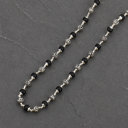 Karungali wood and Lord Ram silver bead close-up