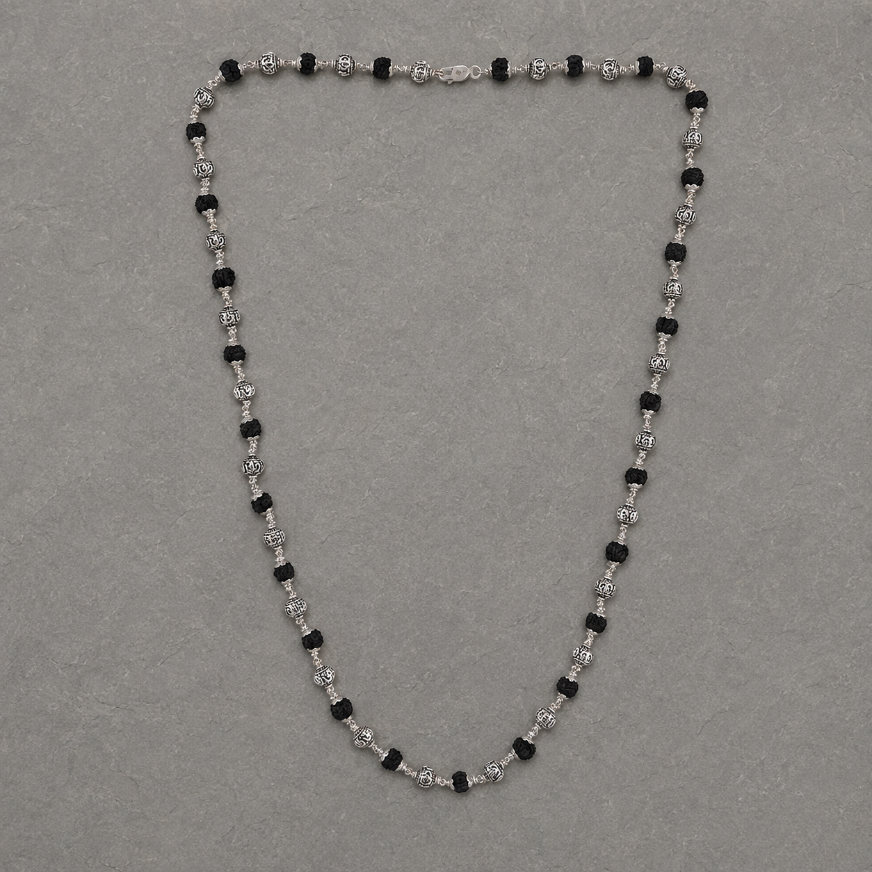 Man wearing 28-inch black Rudraksha 925 silver mala