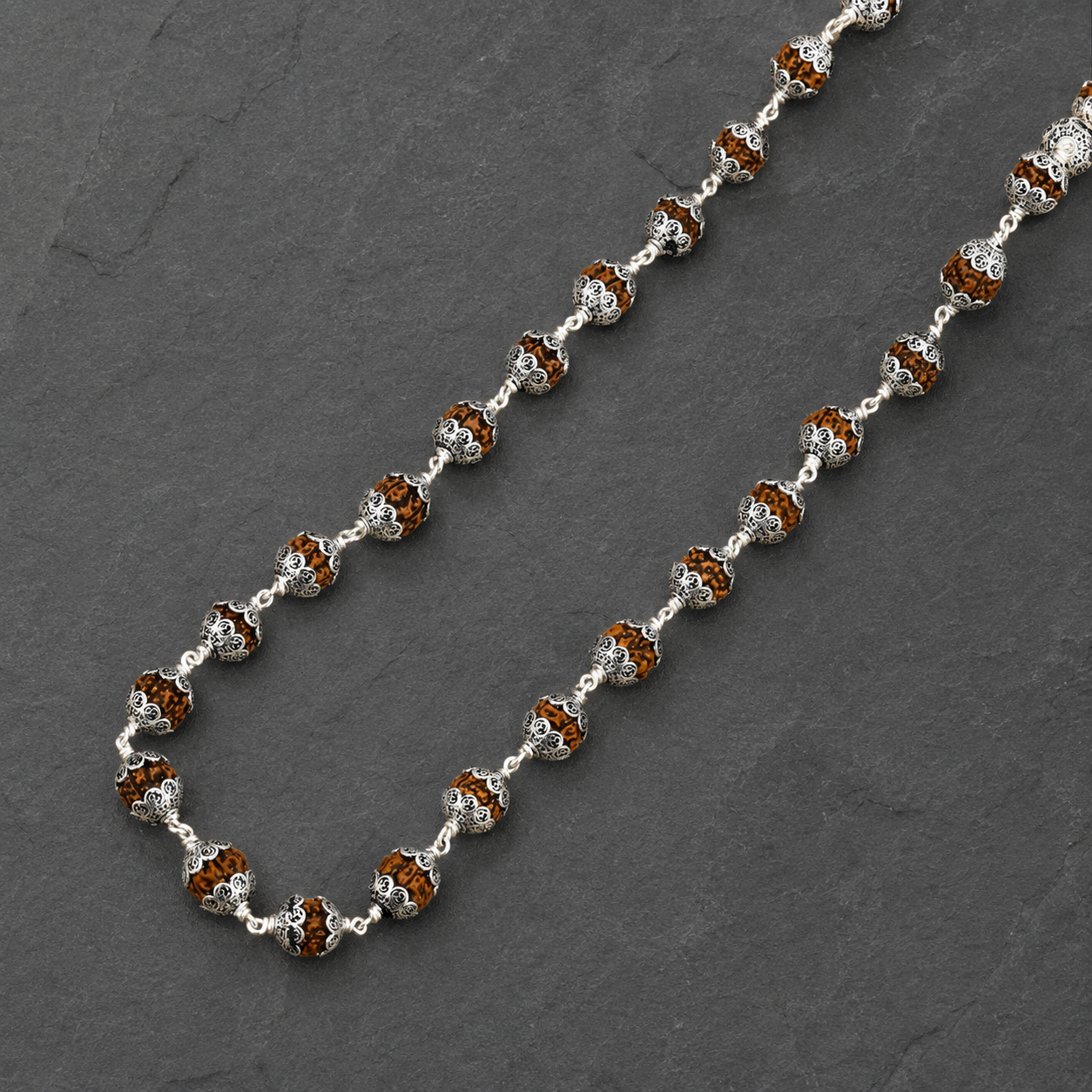 Man wearing premium 925 silver Om cap Rudraksha Mala