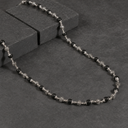 Natural ebony and 925 silver Om bead close-up