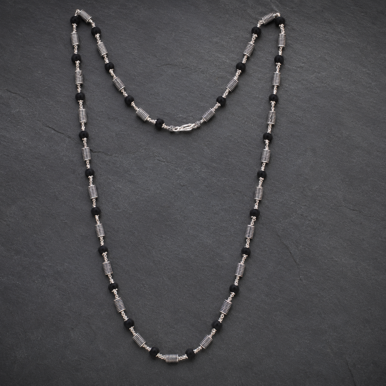 Premium cylindrical bead Karungali Mala styled for meditation