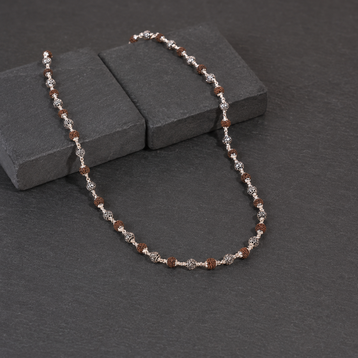 Rudraksha Mala with 925 silver Om beads lifestyle view