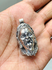 Antique silver Kali face pendant with sculpted hair